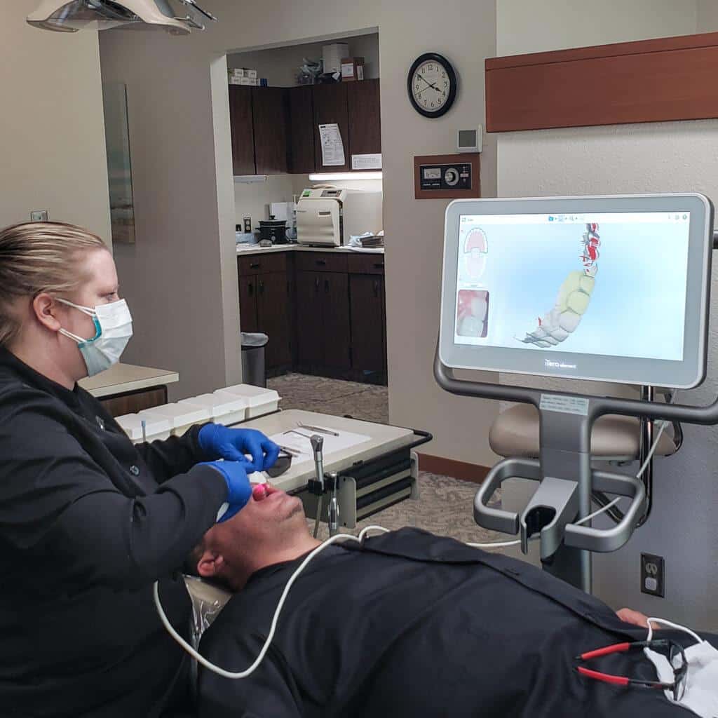 Dental hygienist doing a scan of a patient's teeth in Kirkland, WA